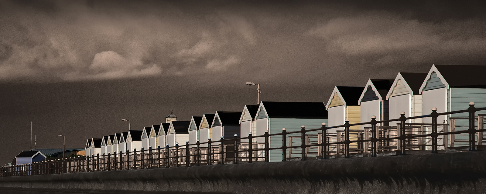Storm Over St Annes Beach Huts by Mike Williamson