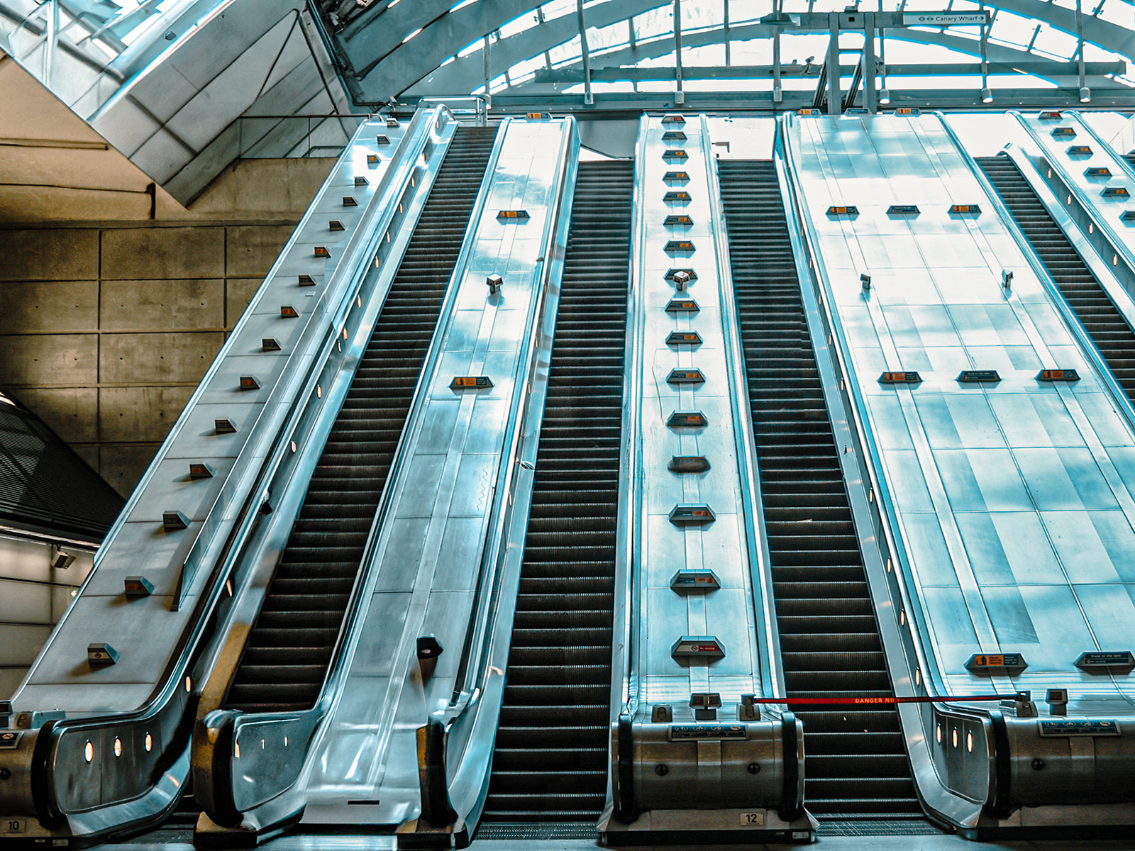 Escalators Canary Wharf Underground by John Scott — Score: 13 pts
