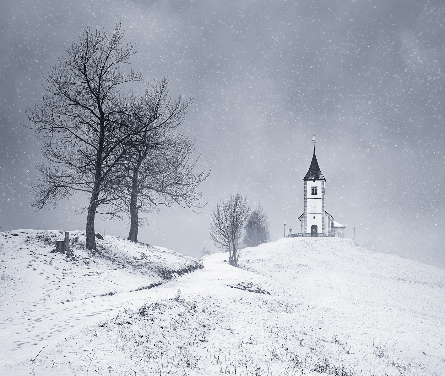 Jamnik Church In The Falling Snow by Carol Watson